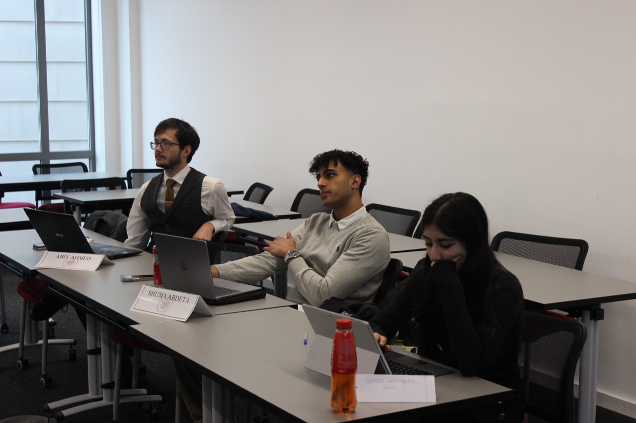 Wide view of a Model United Nations committee session